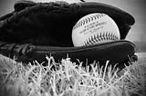 picture of a baseball glove and a baseball