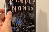 Me holding The Book of Deadly Names