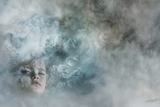 A child’s face on the left bottom with closed eyes partially obscured by misty, foggy swirls.