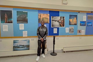 kelani, posing in fornt ofhis works at his recent exhibition tagged Ethereal Ecosystems; A Journey Through Nature’s Beauty”