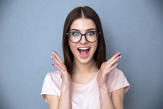 woman in glasses with a big smile