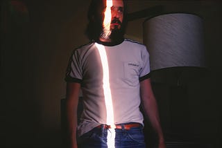 Man with a beam of light dissecting his body