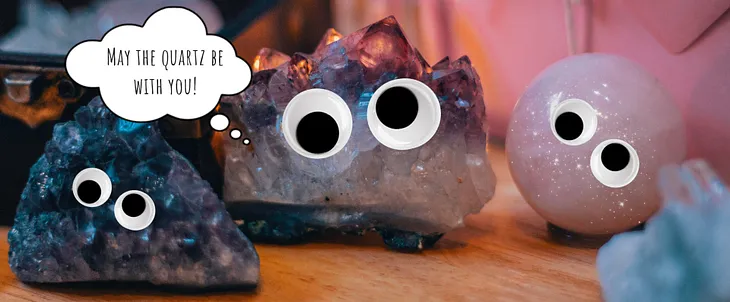 A picture of quartz geodes, with googly eyes and a thought bubble that says “may the quartz be with you!”