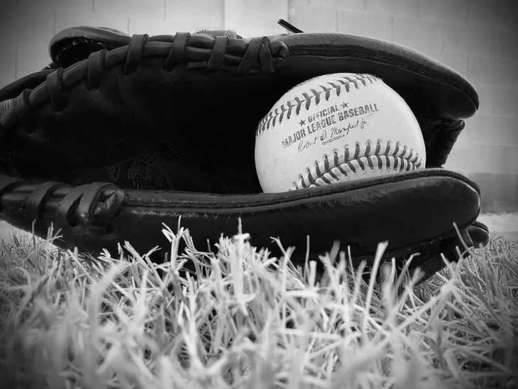Picture of baseball glove and a baseball