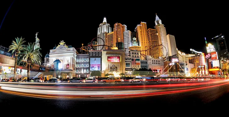 Street view of the New York New York casino in Las Vegas at night.